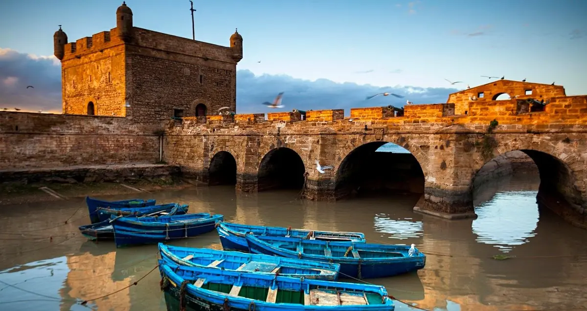 Essaouira's blue fishing boats below the ramparts — seen on the Marrakech day trip